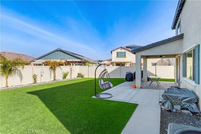 view of yard featuring a patio area and ceiling fan