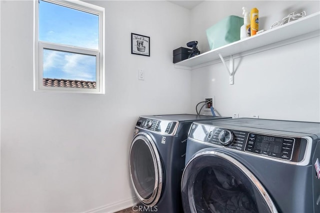 laundry area with separate washer and dryer