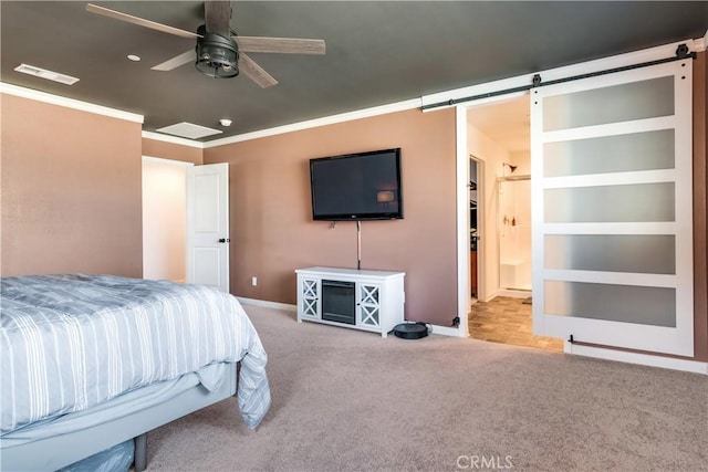 carpeted bedroom featuring crown molding, a barn door, and ceiling fan