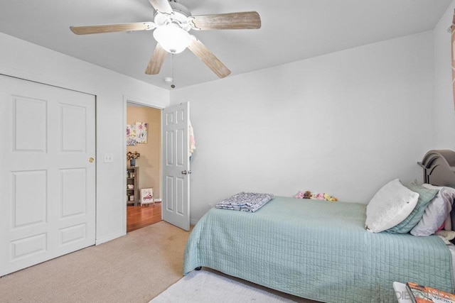 carpeted bedroom with ceiling fan