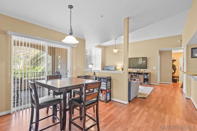 dining area with ceiling fan and light wood-type flooring