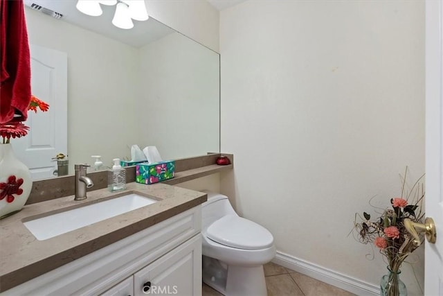 bathroom with tile patterned floors, vanity, and toilet