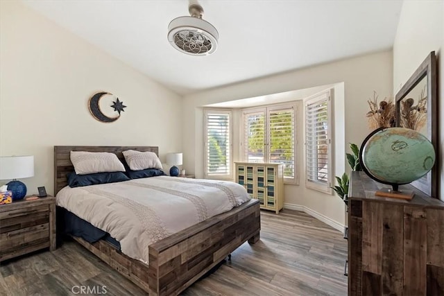 bedroom with hardwood / wood-style flooring