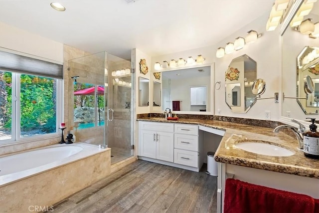 bathroom with vanity, separate shower and tub, and hardwood / wood-style floors