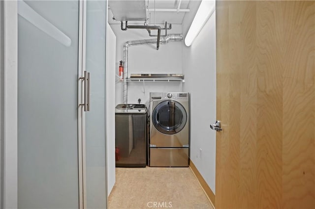 washroom with washer and dryer