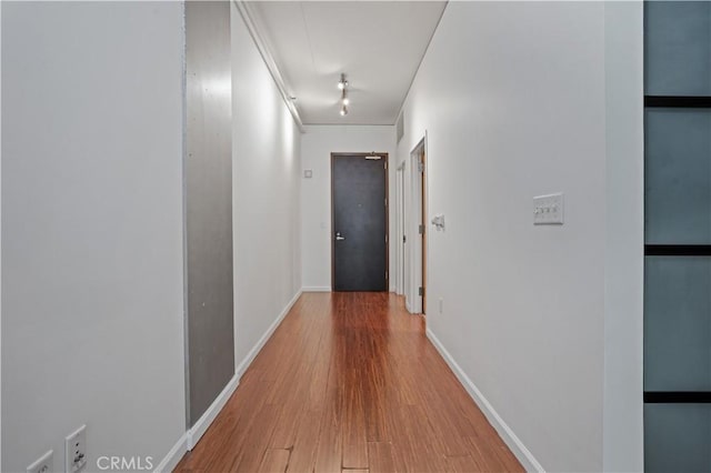 hallway featuring hardwood / wood-style flooring