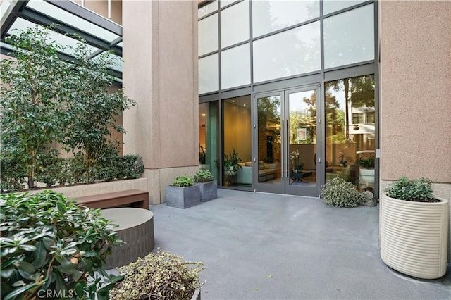 doorway to property with a patio area