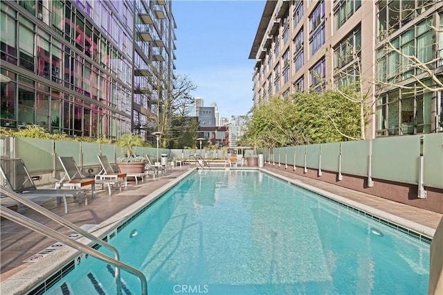 view of swimming pool with a patio