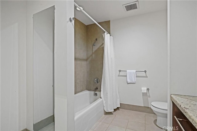 full bathroom with vanity, shower / tub combo, tile patterned floors, and toilet