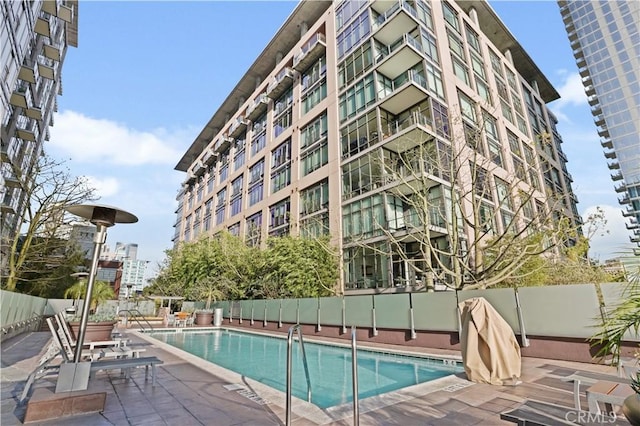 view of swimming pool with a patio