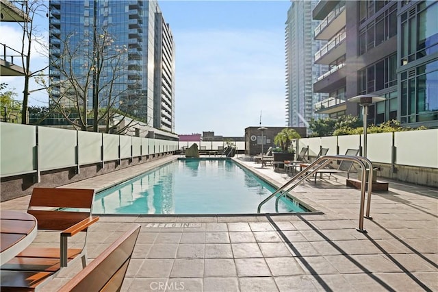 view of pool featuring a patio