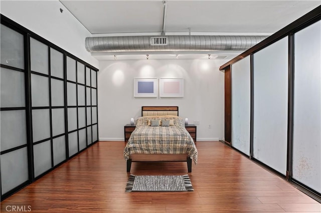 bedroom featuring hardwood / wood-style flooring