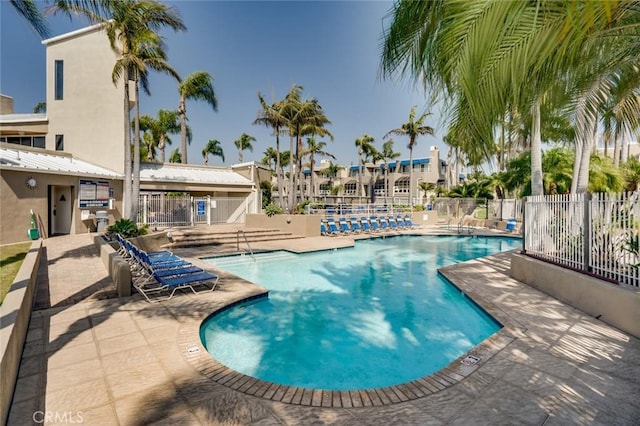 view of swimming pool with a patio