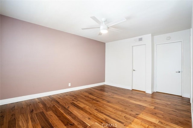 unfurnished bedroom featuring hardwood / wood-style floors and ceiling fan