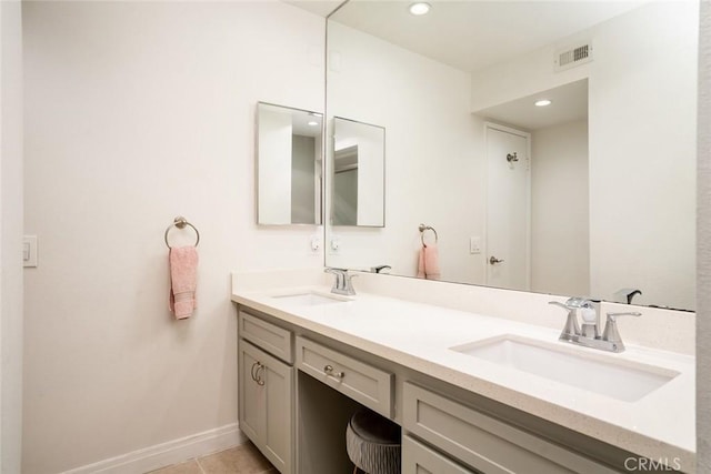 bathroom with vanity and tile patterned floors