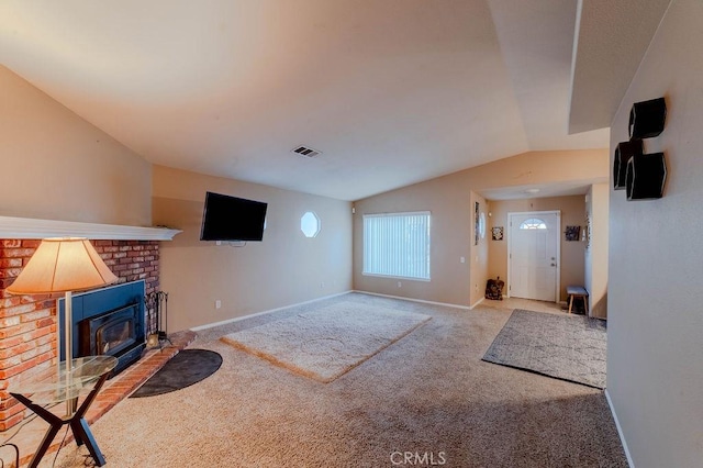 carpeted living room featuring vaulted ceiling