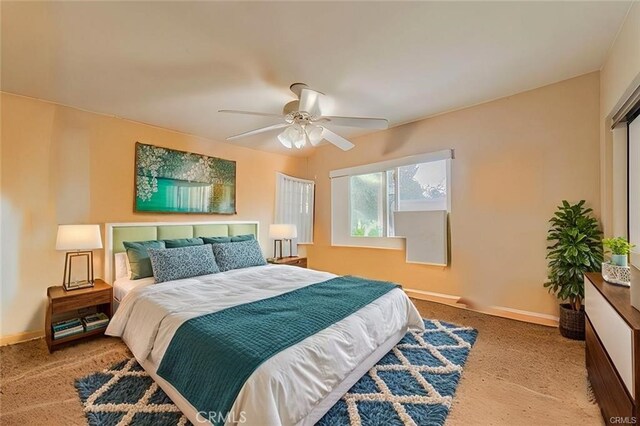 carpeted bedroom featuring ceiling fan