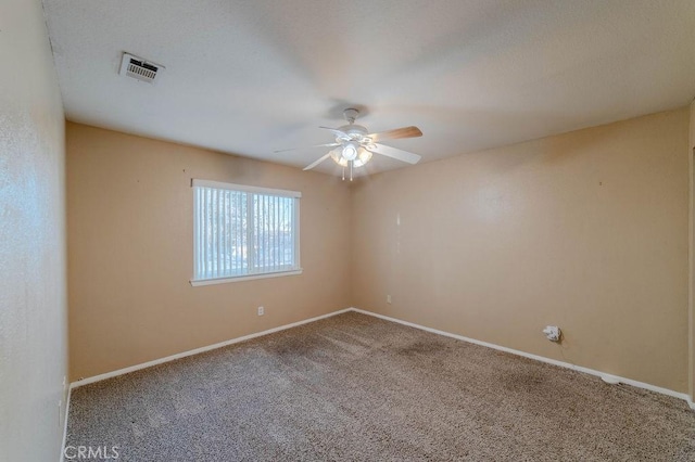 carpeted empty room with ceiling fan