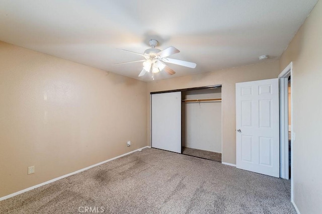 unfurnished bedroom featuring a closet, ceiling fan, and carpet