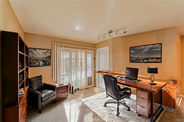 office area featuring light colored carpet and rail lighting