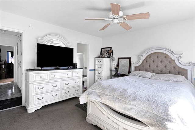 bedroom featuring ceiling fan and dark colored carpet