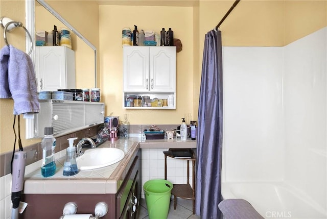 bathroom with vanity and shower / bath combo with shower curtain