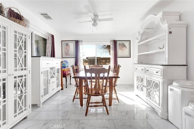 dining area with ceiling fan