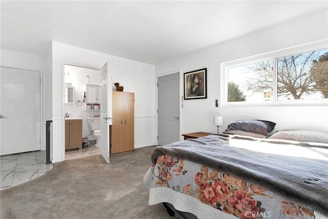 bedroom featuring connected bathroom