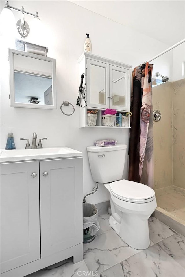 bathroom featuring vanity, a shower with curtain, and toilet