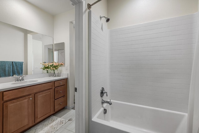 bathroom featuring vanity and tiled shower / bath