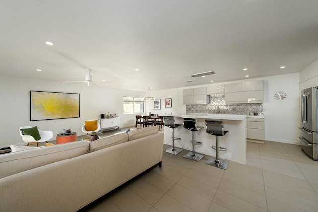 living room with light tile patterned flooring