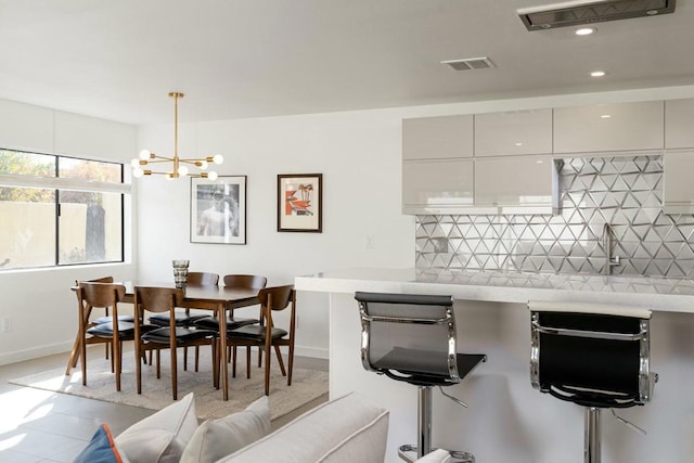 dining room featuring a chandelier