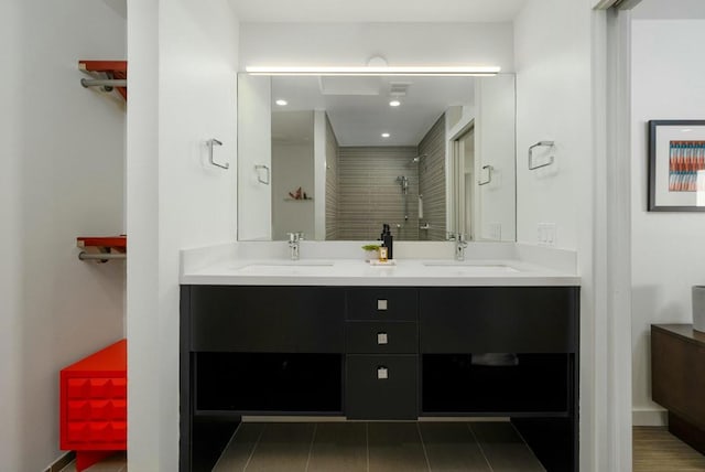 bathroom with vanity and a shower