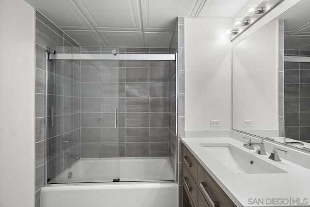 bathroom featuring vanity and enclosed tub / shower combo