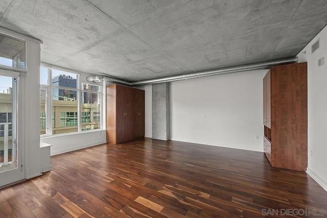 unfurnished room featuring dark hardwood / wood-style floors