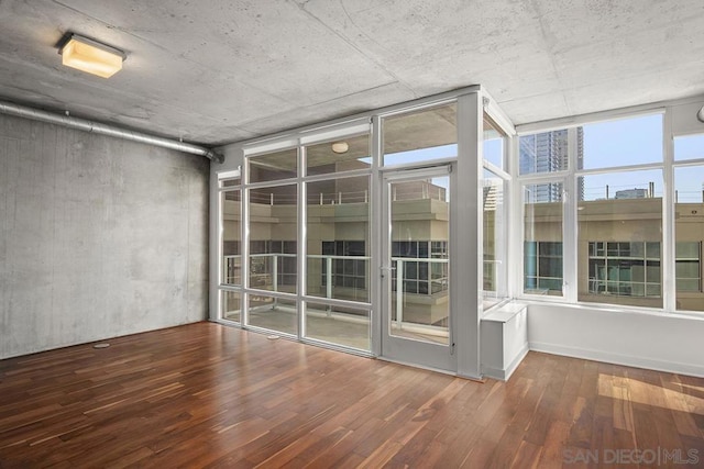 spare room featuring hardwood / wood-style flooring