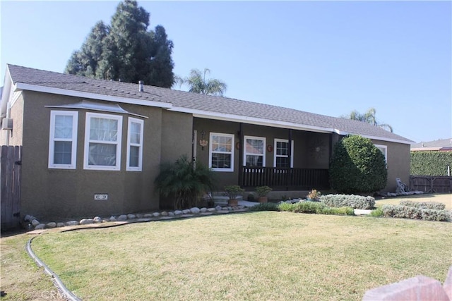 ranch-style home with a porch and a front yard