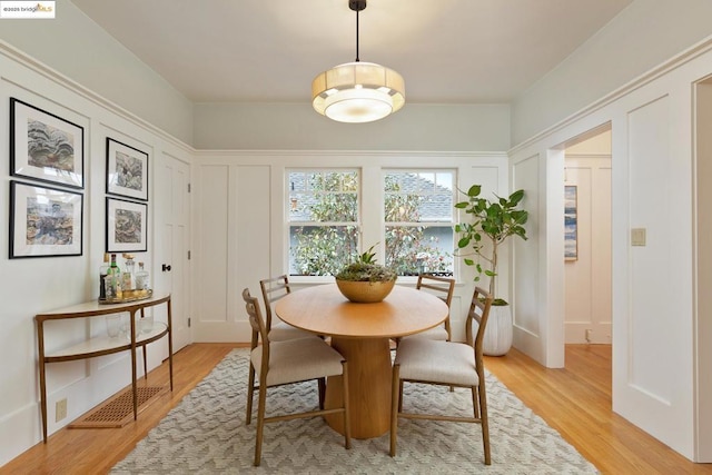 dining area with light hardwood / wood-style floors