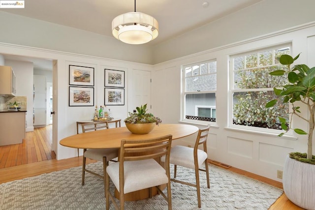 dining area featuring light wood-type flooring