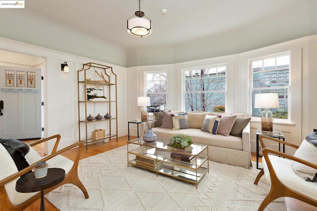 living room with hardwood / wood-style flooring and a wealth of natural light