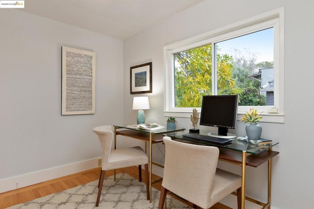 home office featuring wood-type flooring and plenty of natural light