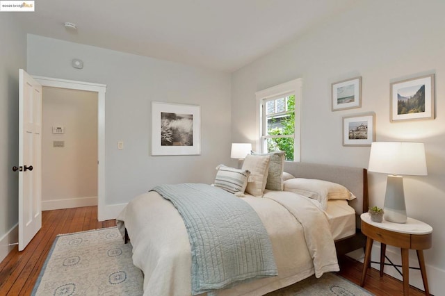 bedroom with hardwood / wood-style flooring