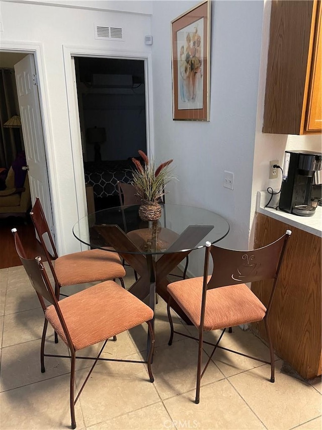 dining space featuring light tile patterned floors