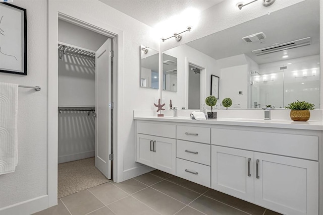 bathroom featuring vanity and tile patterned flooring