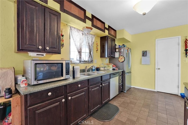 kitchen with sink, dark brown cabinets, and stainless steel appliances