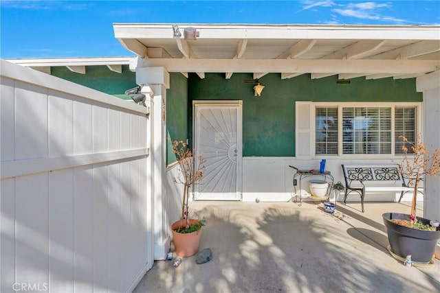 doorway to property with a patio area