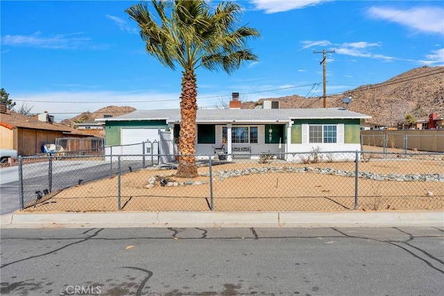 single story home featuring a garage