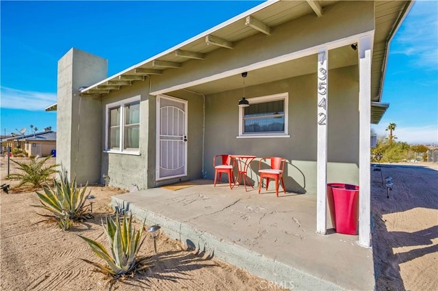 property entrance with a patio