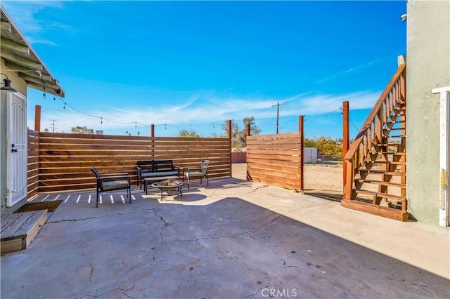 view of patio with a fire pit