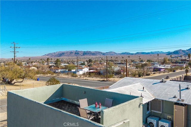 birds eye view of property with a mountain view